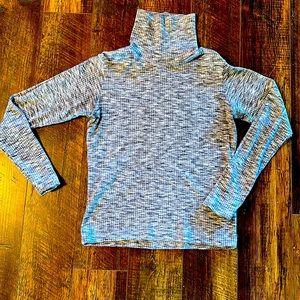 White and gray turtle neck long sleeved active wear sweater